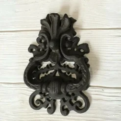 CHEMIN DE CAMPAGNE - Heurtoir de porte ancien claque porte fonte marron 19 x 12 cm