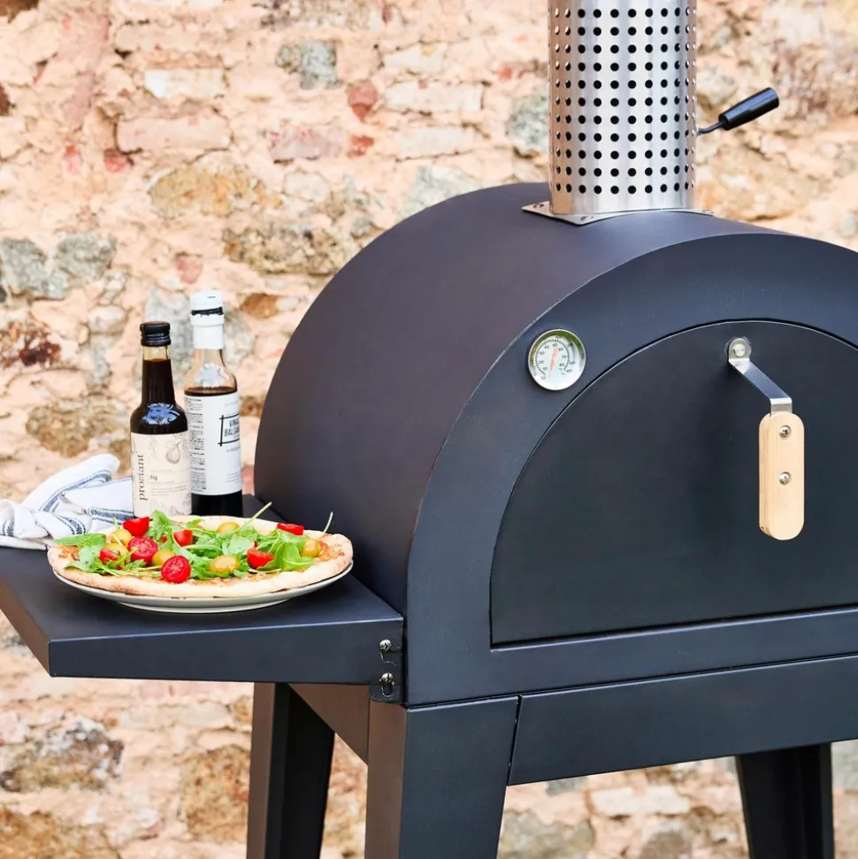 Four à pizza d'extérieur au charbon de bois. Coloris noir - giulia - pierre de cuisson roulette pelle et housse. L70xp63xh122cm